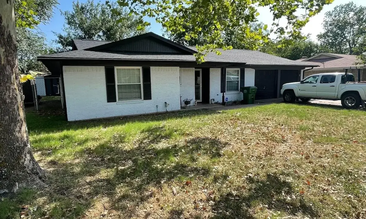 Professional roofing crew working on a residential roof in Brownsville